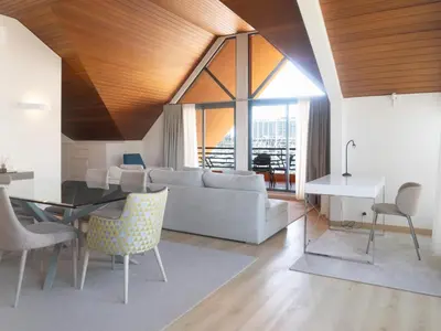 a living room with a couch and a table at Premium Apartment with Vilamoura Marina View in Vilamoura