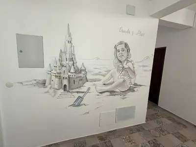 a mural of a woman and a castle on a wall at Camilas place in Faro