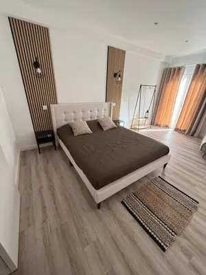 a bedroom with a large bed in a room at Camilas place in Faro