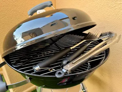 a helmet and utensils are sitting on a rack at Cosy 1-Bedroom Apartment with Private Terrace in Loulé in Loulé
