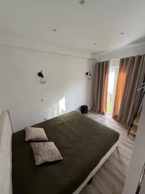 a bedroom with a large bed in a room at Camilas Place 2 in Bicas
