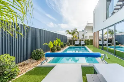 a swimming pool in the backyard of a house at Villa Memorias by Algarve Holidays in Páteo