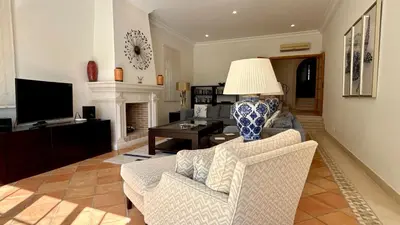 a living room with a couch and chairs and a lamp at Belinha - PINHEIROS ALTOS in Ludo