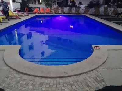 a swimming pool with blue water in a house at 150m to the beach at Sol a Sul apartments in Albufeira