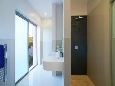 a bathroom with a white sink and a shower at Apartment Pine Hills Jade by Interhome in Vilamoura
