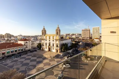 a view of a city from a balcony of a building at The View at the Downtown 5 in Faro