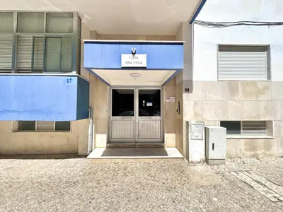 a front door of a building with a sign on it at Quarteira Central Beach 5 by Homing in Quarteira