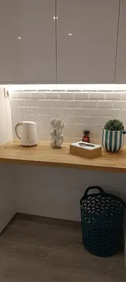 a counter in a kitchen with a counter top with a pot and a bowl at Skynest 61 Faro Airport Guest House in Faro