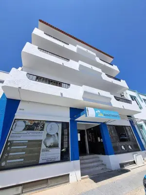 a white building with blue trim at Budget Beach Center - B4 in Albufeira