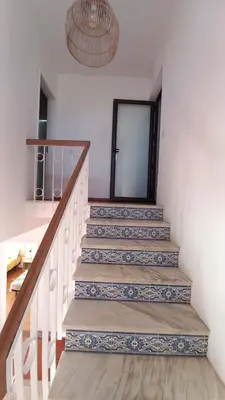 a stairway with blue and white tiles on it at Villa UM in Albufeira