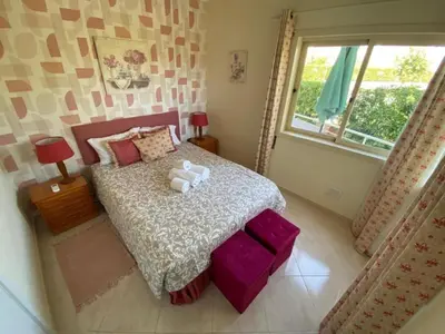 a bedroom with a bed with two teddy bears on it at Modern 2BR Vilamoura Stay Pool Access Golf Nearby 15 Percent Off in Quarteira