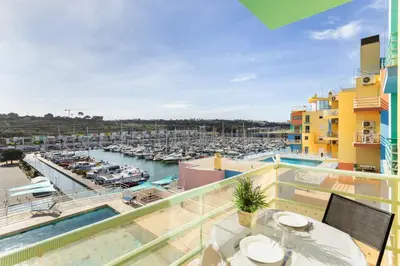 a balcony with a view of a marina at Marina Paradis Bleu in Albufeira