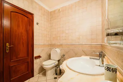 a bathroom with a toilet and a sink at Retiro dos Calicos by Dreamplaces in Albufeira