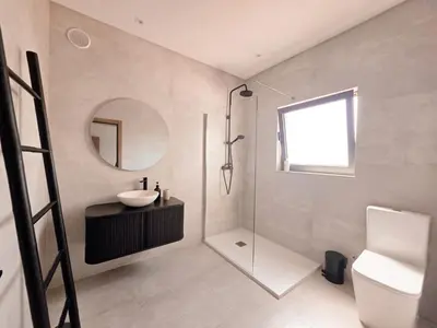 a bathroom with a sink and a mirror at Casa Shiva in Albufeira