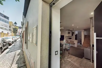 a view of a street with cars parked on the side of a building at Casa dos Quatro in Faro