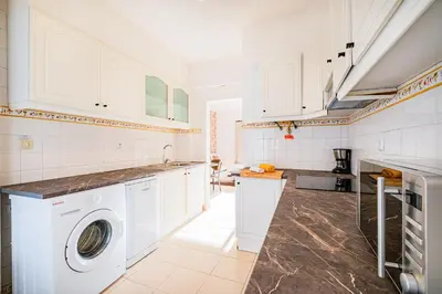 a bathroom with a toilet and a sink and a shower at Casa Gale Mar in Galé