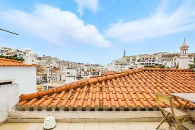 a view of the roofs of white buildings at T2 Apartment near the beach in Albufeira