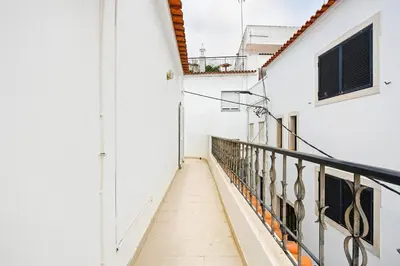 a group of white houses with orange roofs at T2 Apartment near the beach in Albufeira