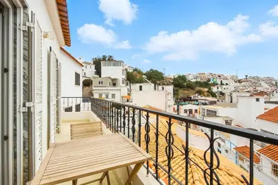 a dining room with a table and chairs at T2 Apartment near the beach in Albufeira