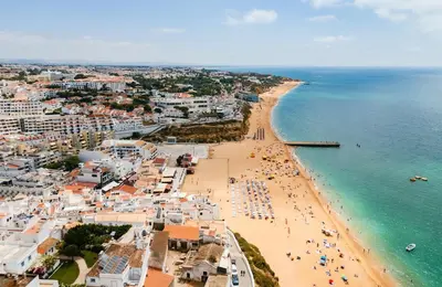 an aerial view of a city with buildings and the ocean at T2 Apartment near the beach in Albufeira