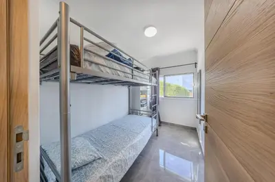 a bedroom with two bunk beds in a house at Quinta Veigas in Medronhal