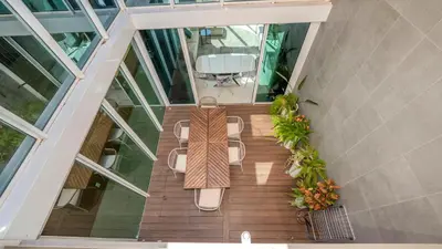 an overhead view of a balcony with a table and chairs at Central Vilamoura Casa A in Quarteira