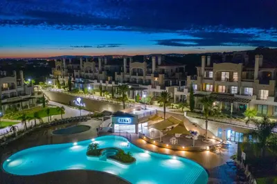 an aerial view of a resort at night at Pine Hills Vilamoura in Quarteira
