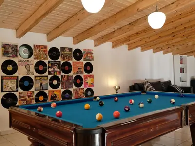 a swimming pool with two inflatable boats in it at Casa Da Liberdade