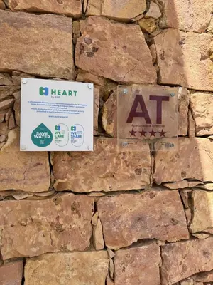 a stone wall with aat signs on it at FourSeasons Vilamoura in Quarteira