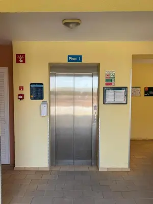 an elevator in a building with a silver door at FourSeasons Vilamoura in Quarteira