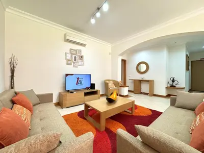 a living room with a couch and a tv at Vilamoura Victoria Boulevard With Pool by Homing in Vilamoura