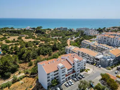 an aerial view of a building near the ocean at Stunning Apartment By Dreamplaces in Albufeira