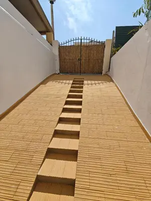 a set of wooden steps leading up to a house at Santos Studio in Faro