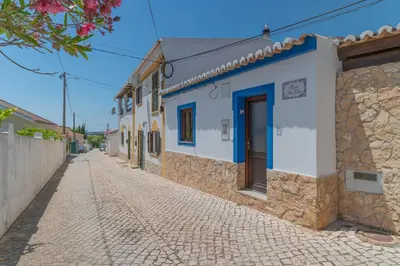 a cobblestone street in a village with buildings at Perfect To Relax in Algoz