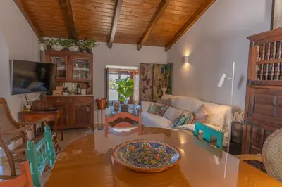 a living room with a table and a couch at Perfect To Relax in Algoz