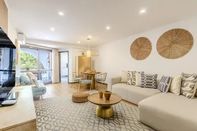 a living room with a couch and a table at #335 Recanto do Manaca by Home Holidays in Guia