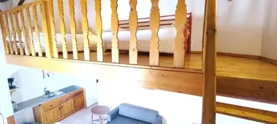 a room with a staircase leading up to a bedroom at Quinta do Lagar - 01 in Albufeira