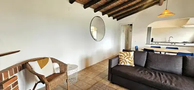 a living room with a couch and a table at Quinta do Lagar - 05 in Albufeira