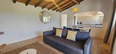 a living room with a couch and a table at Quinta do Lagar - 05 in Albufeira