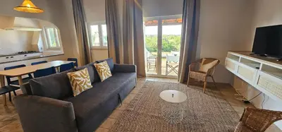 a living room with a couch and a table at Quinta do Lagar - 05 in Albufeira