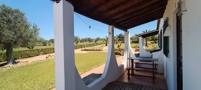 a view from the front porch of a house with a view of a field at Quinta do Lagar - 07 in Albufeira