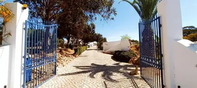 an entrance to a house with a blue gate at Quinta do Lagar - 07 in Albufeira
