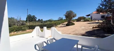 a patio with a table and chairs and a fence at Quinta do Lagar - 09 in Albufeira