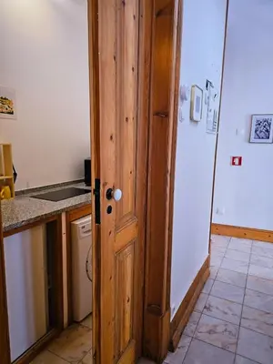 a bedroom with a bed with two crosses on it at The Central Faro in Faro