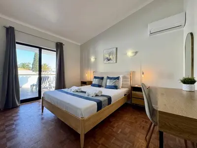 a bedroom with two beds in a room at Albufeira Summer Villa 3 With Pool by Homing in Sesmarias
