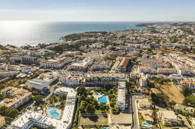 an aerial view of a city and the ocean at Casa Alonso 2 Bedroom Apartment with Pool in Albufeira