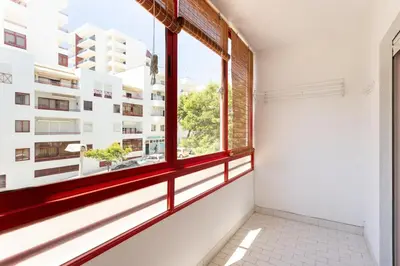 an empty room with a window in a building at SunnyQuarters WalktoBeach 2BR AC