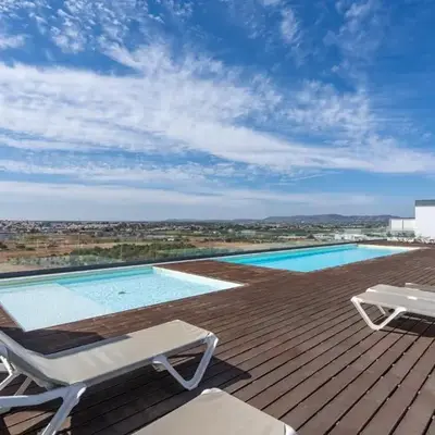 Rooftop Pools & Balcony Haven by HostWise