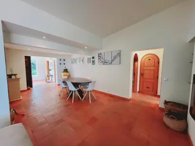 a room with a table and chairs and a door at Golf&Mar By Garvetur Villas in Loulé