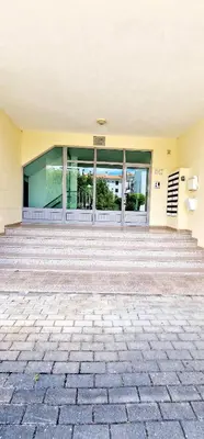 a building with a staircase in front of a building at Fantástico T2 Perto da Praia da Falésia, Albufeira in Albufeira